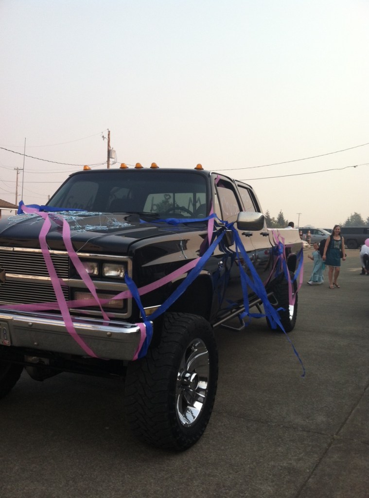 The wedding getaway car against the smoke choked sky.